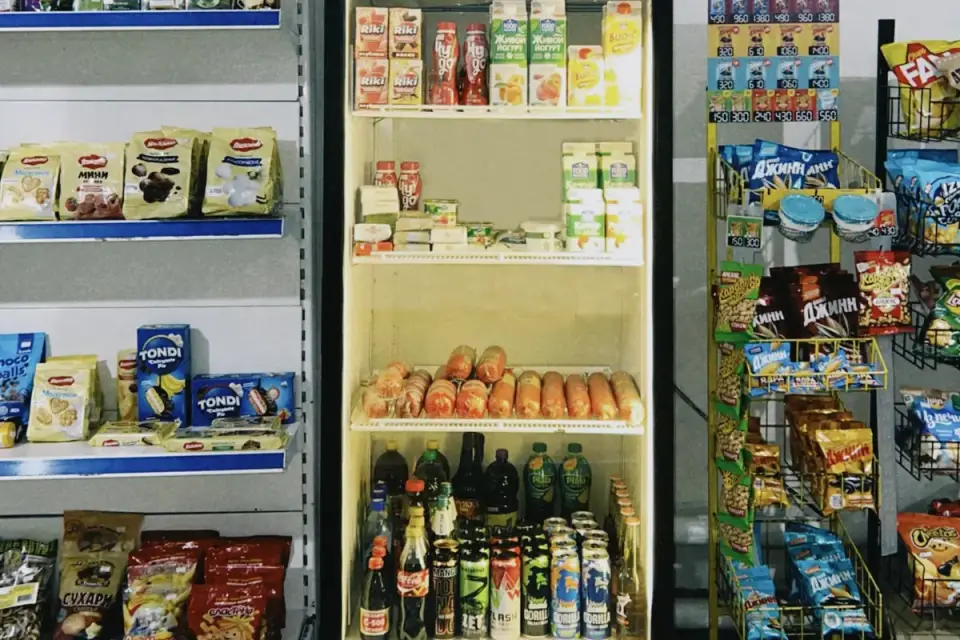 A pet probiotic supplement bottle stored on a refrigerator shelf